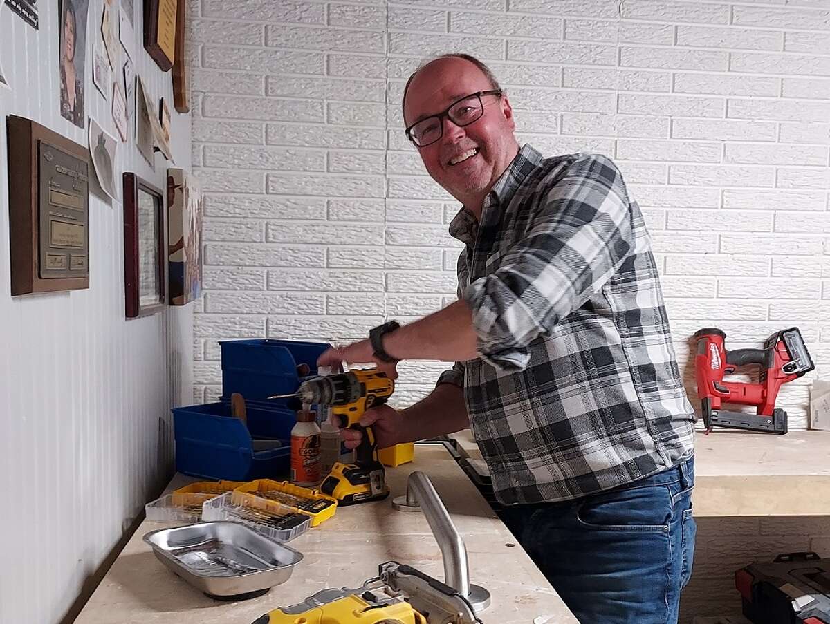 Retiree Todd Beard, shown here in his work area at his home in Midland, says he enjoys being a volunteer handyman for Senior Services of Midland County. He also volunteers as a driver for its transportation service. 