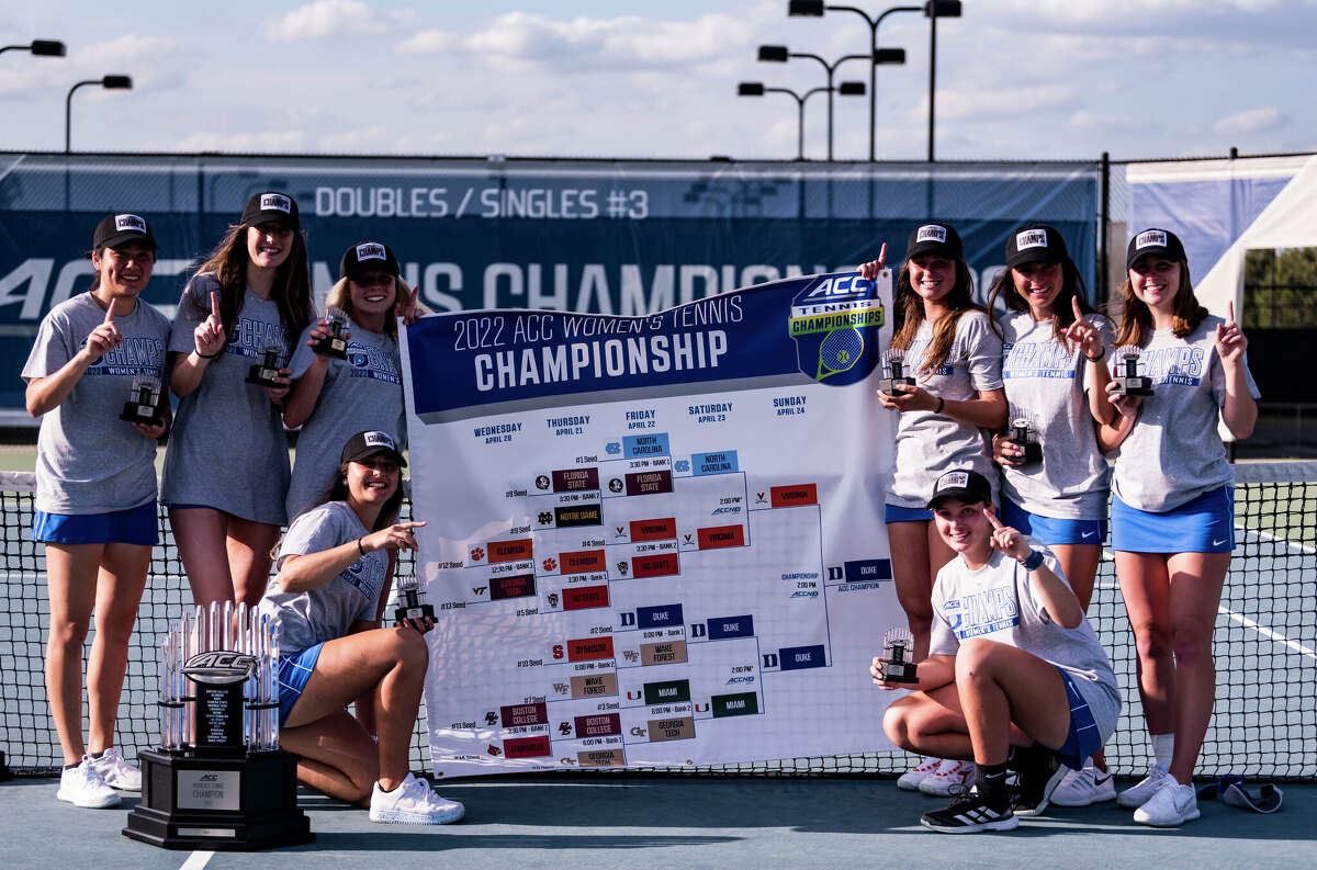 Ellie Coleman (lower right) and her Duke teammates pose with the ACC Championship banner in Rome, Ga., recently.