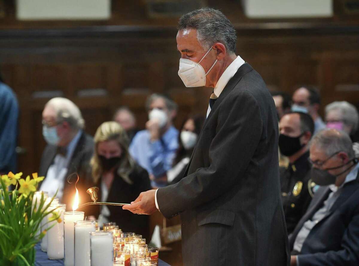 Memorial candles are lit in memory of the six million killed during the Holocaust at the 37th Annual Town of Fairfield Holocaust Commemoration at First Church Congregational in Fairfield, Conn., on Wednesday, April 27, 2022.