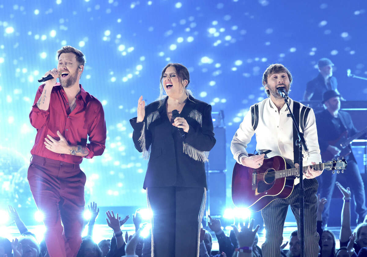 LAS VEGAS, NEVADA - MARCH 07: (L-R) Charles Kelley, Hillary Scott, and Dave Haywood of Lady A perform onstage during the 57th Academy of Country Music Awards at Allegiant Stadium on March 07, 2022 in Las Vegas, Nevada. (Photo by Kevin Winter/Getty Images for ACM)
