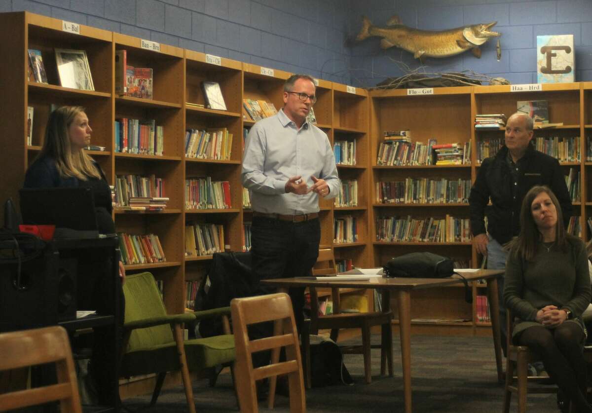 Ashley Dunneback (left), design architect for TowerPinkster; Vince Novak, TowerPinkster project manager; and Dan LaMore, senior vice president of West Michigan Operations for the Christman Company, give a presentation Wednesday during a Manistee Area Public Schools work study session in the Kennedy Elementary library.