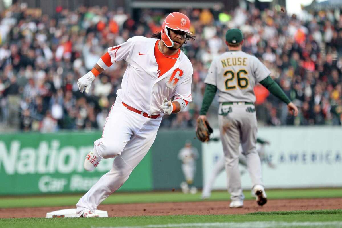 San Francisco Giants’ Brandon Crawford rounds third base while scoring on Wilmer Flores’ 2nd inning double against Oakland Athletics during MLB game at Oracle Park in San Francisco, Calif, on Tuesday, April 26, 2022.