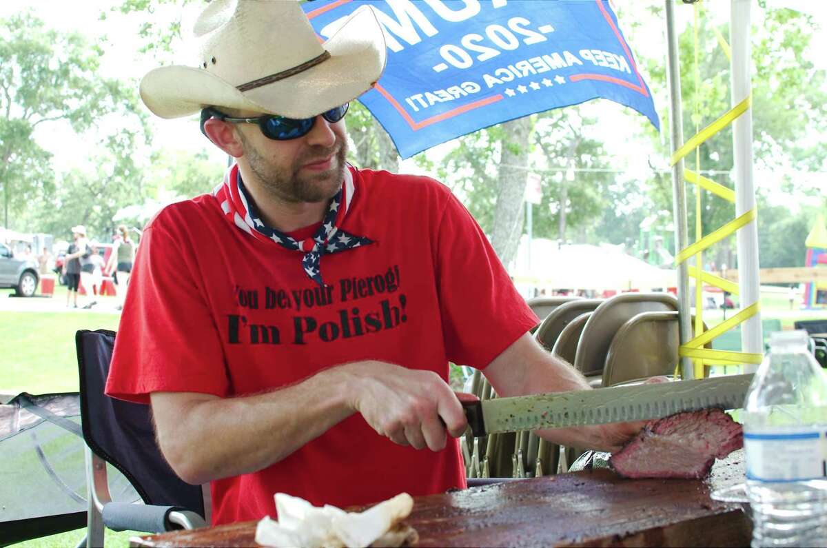 PT Cooker team member Danny Shaw slices brisket during the cook-off during a previous League City Music Festival and BBQ Cook-Off. For the first time in decades, admission will be free to the public.