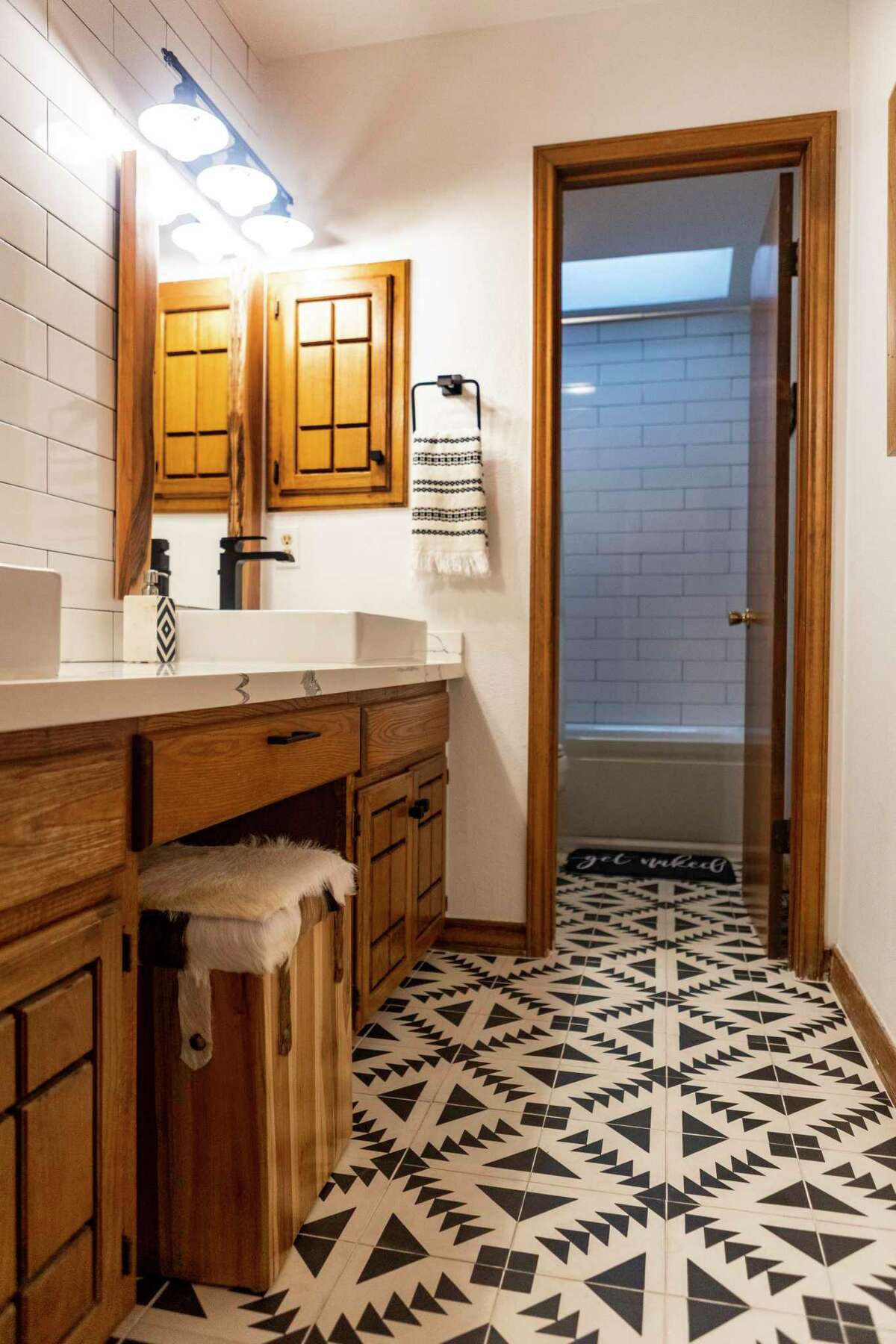 Pressed concrete tiles are a main feature the upstairs bathroom.