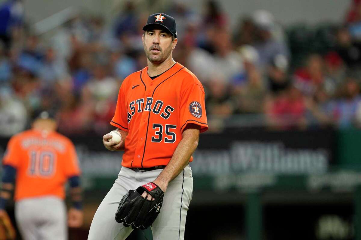Houston Astros starting pitcher Justin Verlander walks behind the mound in the seventh inning of a baseball game against the Texas Rangers, Thursday, April 28, 2022, in Arlington, Texas. (AP Photo/Tony Gutierrez)