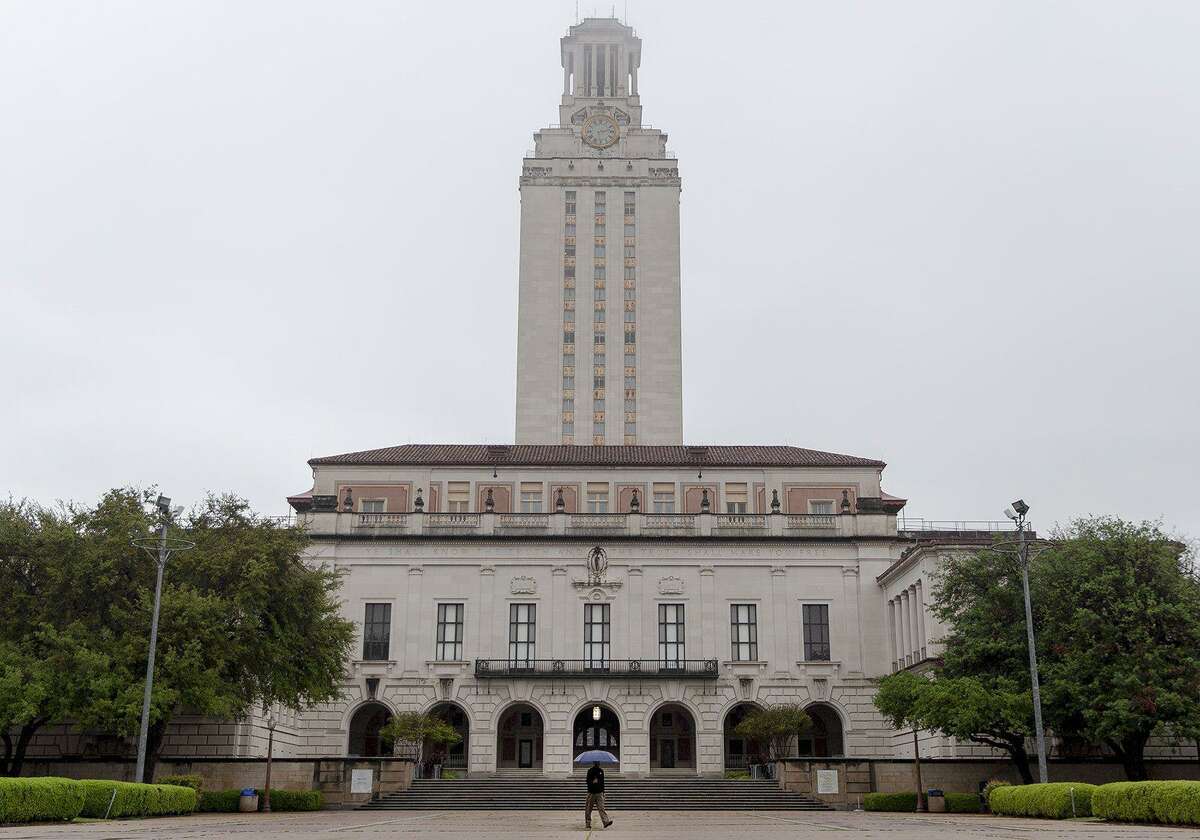 A man walks in front of the UT Tower on the University of Texas campus. (Nick Wagner/Austin American-Statesman/TNS)