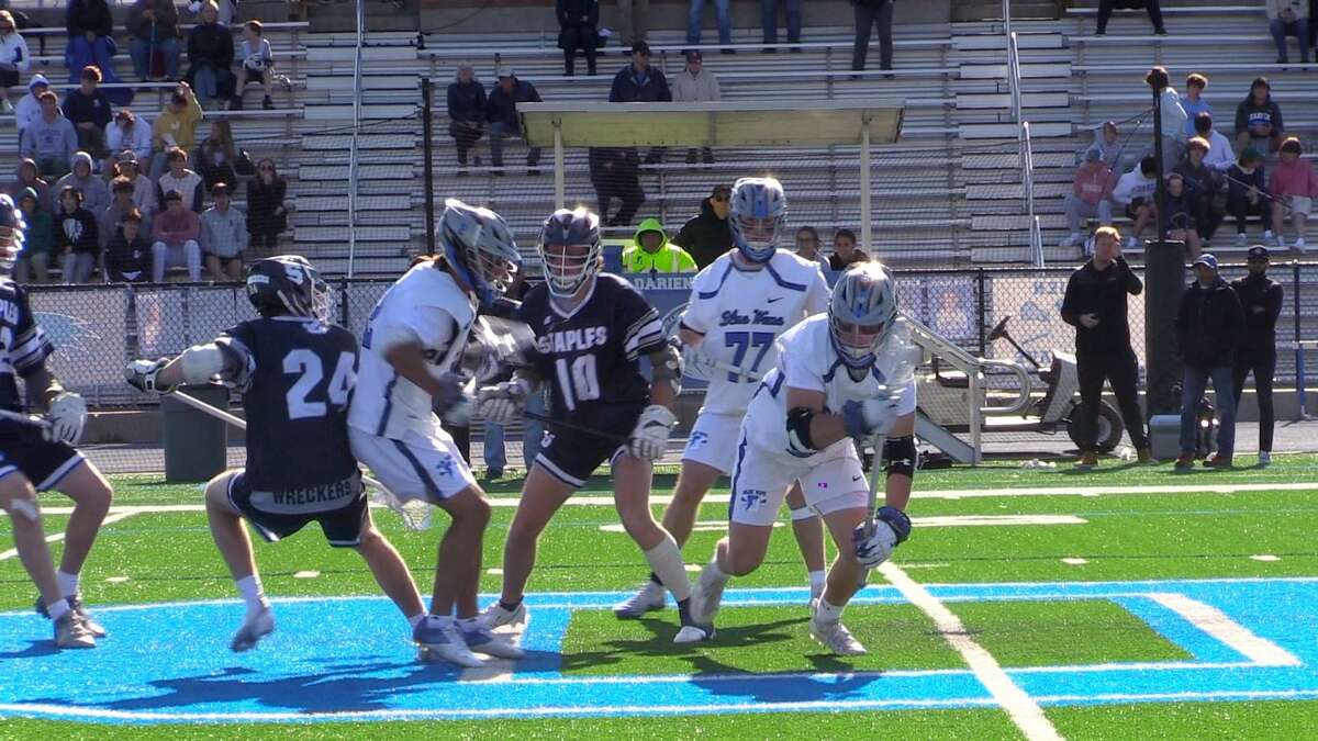 Action from a boys lacrosse game between Staples and Darien on Thursday, April 28, 2022 in Darien, Conn.