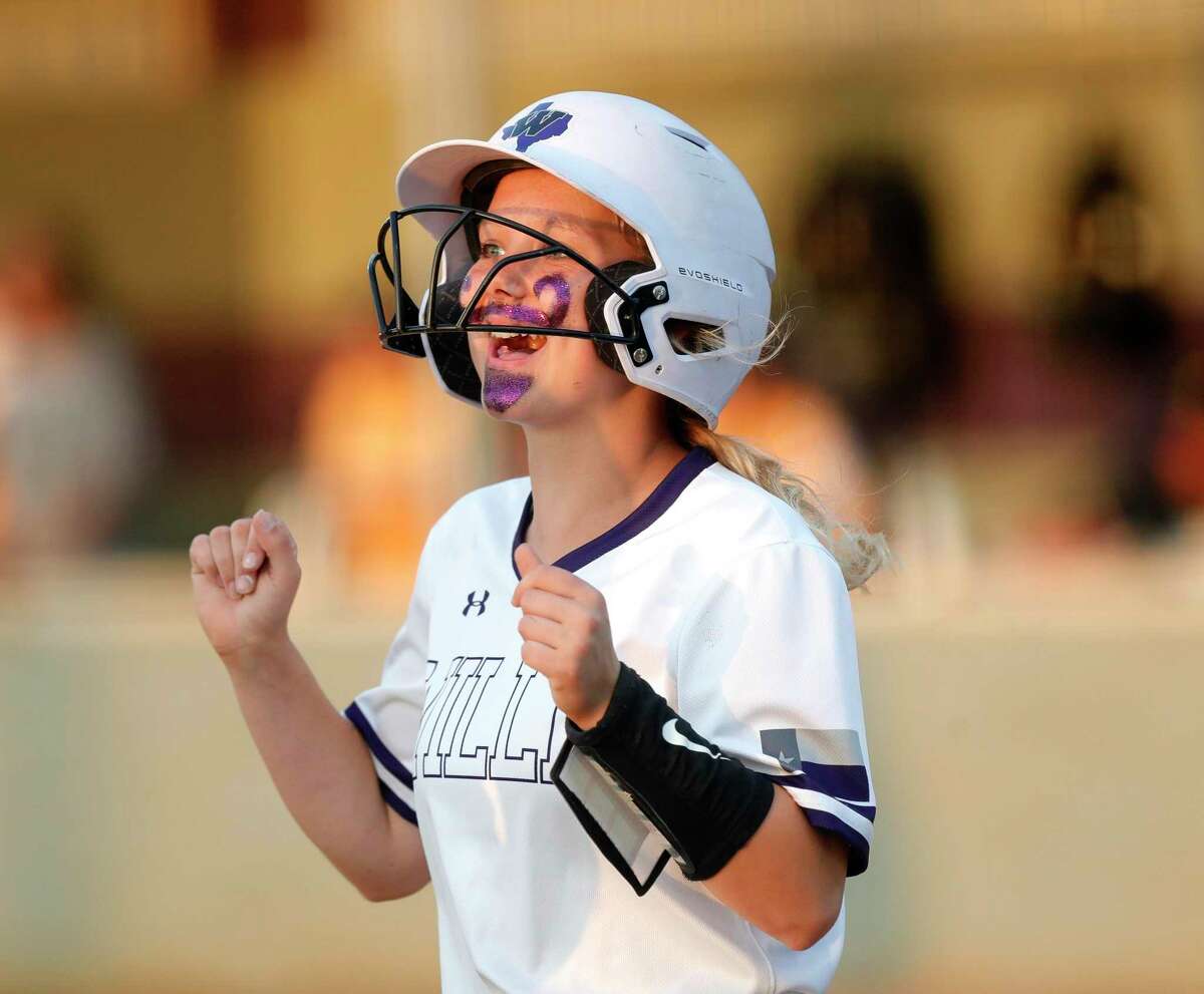 Jolie Boyd #15 of Willis reacts after scoring on a Eisenhower error as part of a seven-inning second inning fo the Lady Wildkats during a Region III-6A high school softball bi-district playoff game at Willis High School, Thursday, April 28, 2022, in Willis.