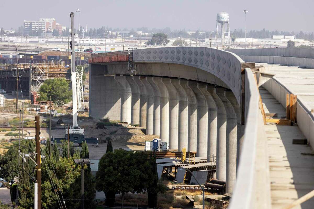 Construction crews work on completing the Central Valley segment of the High Speed Rail Authority, Cedar Viaduct in Fresno, California where it crosses the 99 freeway, Thursday 23 September 2021 in Fresno, CA.