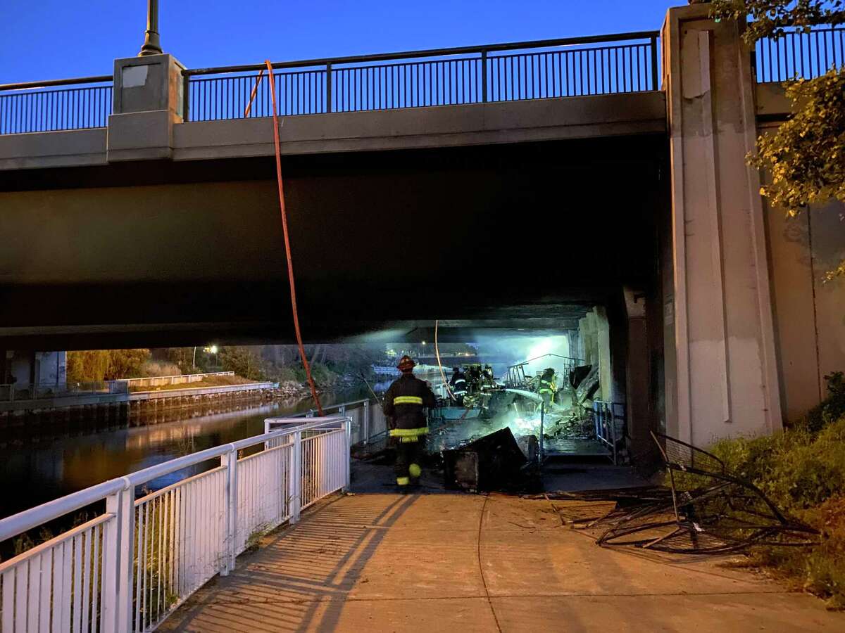 A fire quickly tore through a small homeless encampment beside Oakland’s Lake Merritt Channel on Thursday, further displacing one resident, officials said.