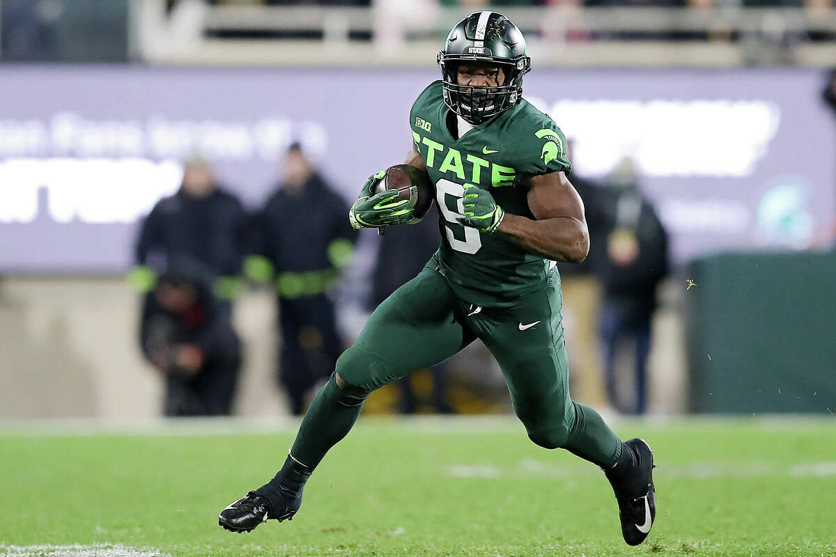 Kenneth Walker III #9 of the Michigan State Spartans runs up the field against the Maryland Terrapins in the first half at Spartan Stadium on November 13, 2021 in East Lansing, Michigan.