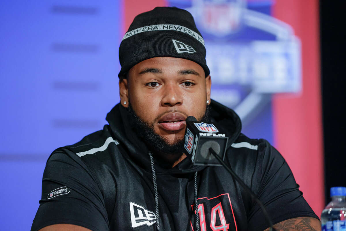 Travis Jones of the Connecticut Huskies speaks to reporters during the NFL Draft Combine at the Indiana Convention Center on March 4, 2022 in Indianapolis, Indiana.