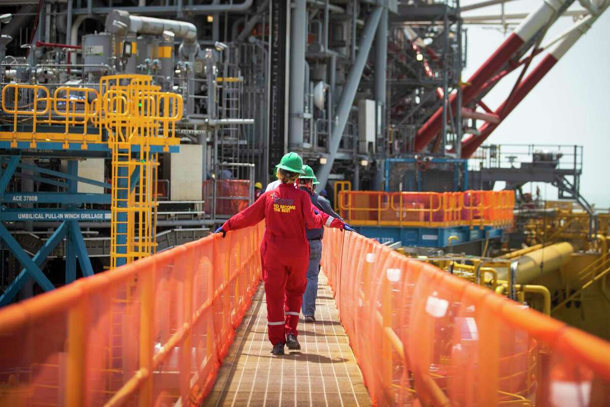 Workers cross the gangplank to Shell’s Vito platform as construction continued on the project at the Kiewit Offshore Services complex in Ingleside. The Gulf of Mexico Gulf in symbolizes the changes that both the offshore sector and broader energy industry have gone through
