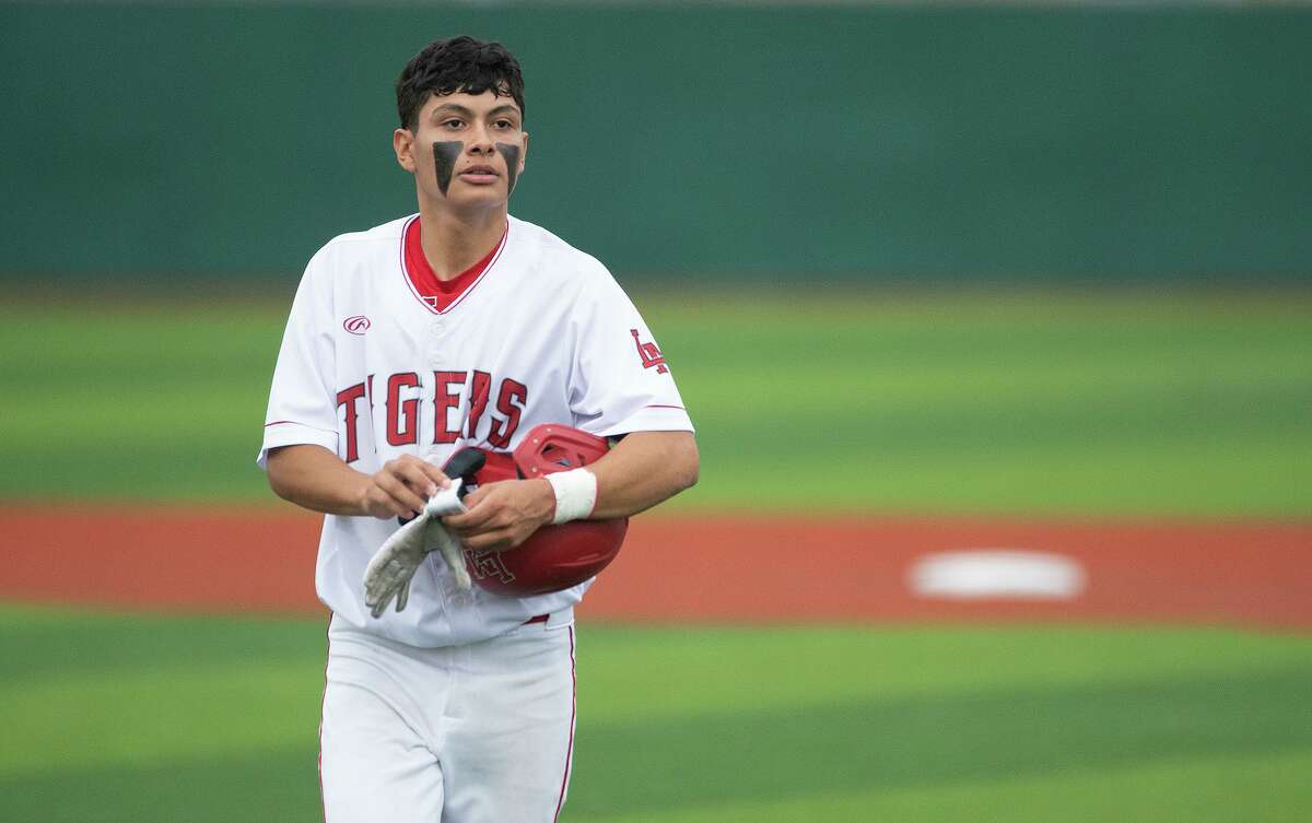 Martin High School’s Aldo Alarcon returns to the dugout after an inning during a game against Rio Grande City High School, Tuesday, April 26, 2022 at Veteran's Field.