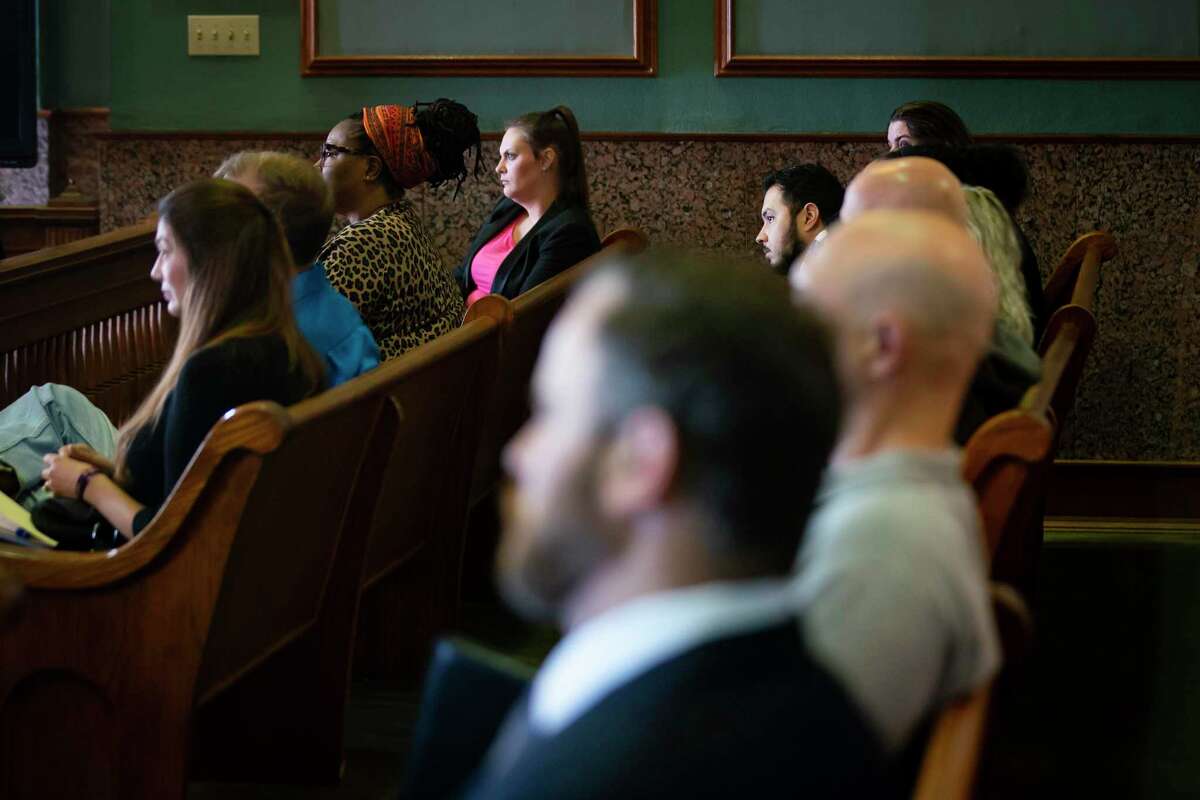 Defendants listen as Tarrant County Judge Ralph Swearingin Jr. explains the voluntary mediation program for defendants and debt collectors appearing in his Fort Worth courtroom.