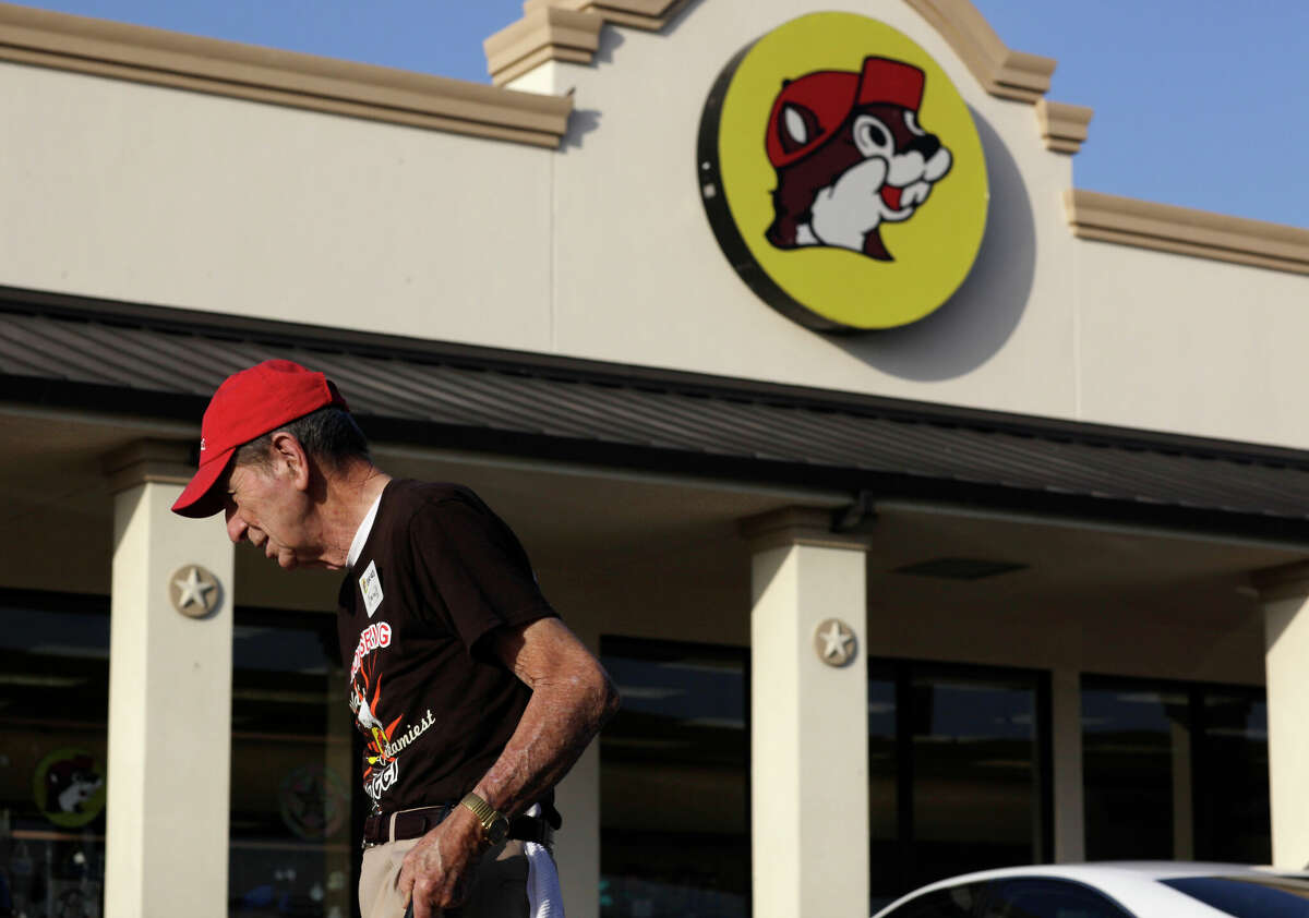 A Buc-ee's employee cleans up around the store on IH-10 east of Luling.
