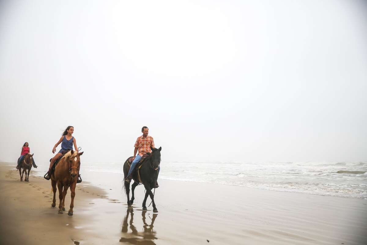 Horseback riding on Whitecap Beach in Corpus Christi, Texas. 