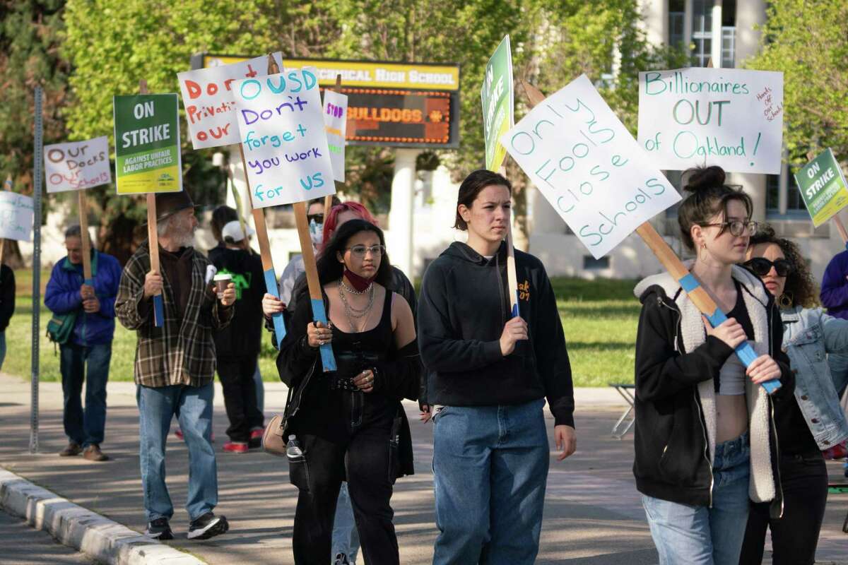 Students and teachers rally in front of Oakland Technical High School during a one-day protest of budget cuts and school closures in Oakland, California on Friday, April 29, 2022.