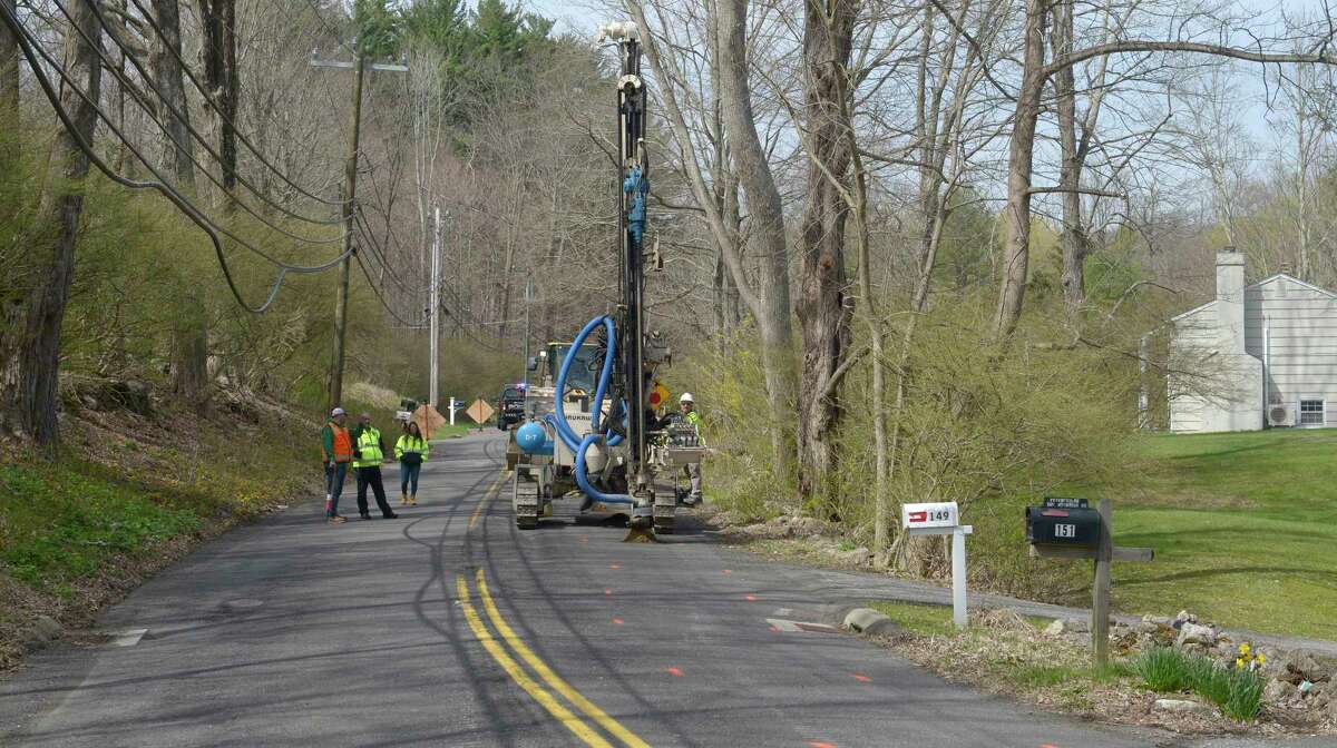 A crew conducts sub-surface rock test drilling on Haviland Road as part of the preparation to install new underground force main piping to the South Street Wastewater Treatment Facility in Ridgefield, Conn. Wednesday, April 21, 2022.