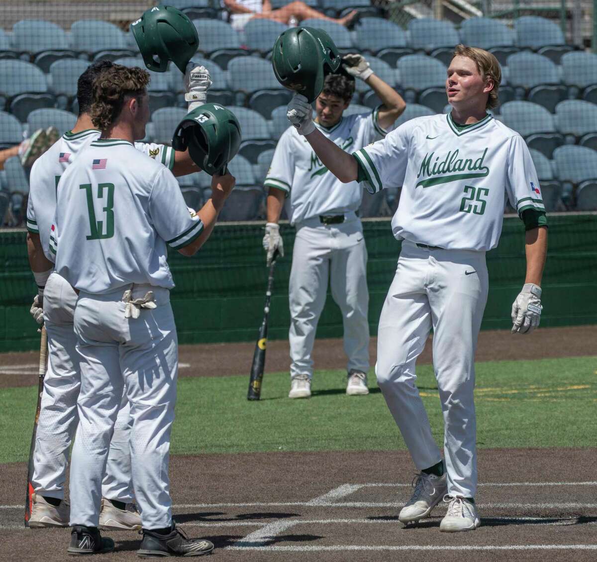 Midland College's Michael Weidner is congratulated by teammates at home plate after a two-run home run against Western Texas College 04/29/2020 at Christensen Stadium. Tim Fischer/Reporter-Telegram