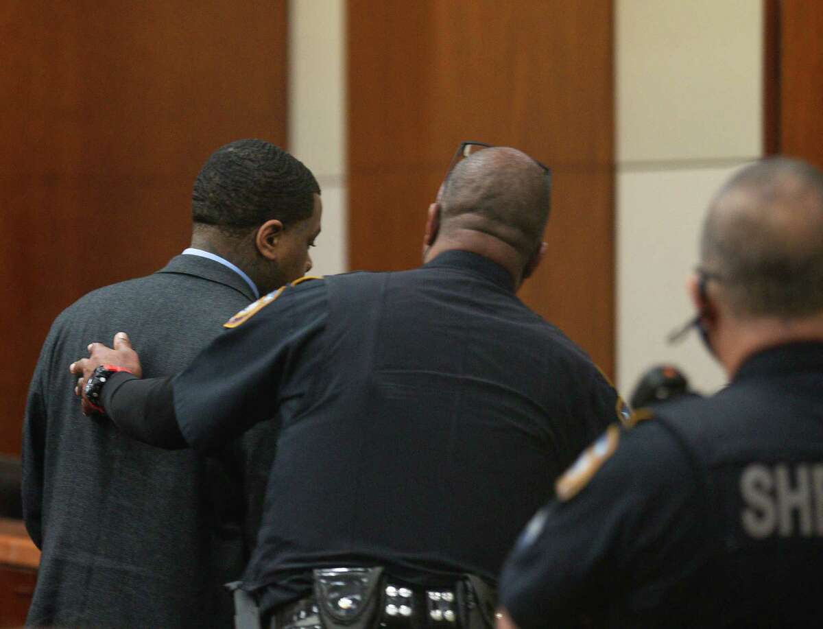 Larry Woodruffe is ushered out by Harris County Sheriff’s Office deputies after being found guilty of capital murder for the drive-by shooting death of Jazmine Barnes, on Friday, April 29, 2022, in Houston. Woodruffe was sentenced to life in prison without parole.