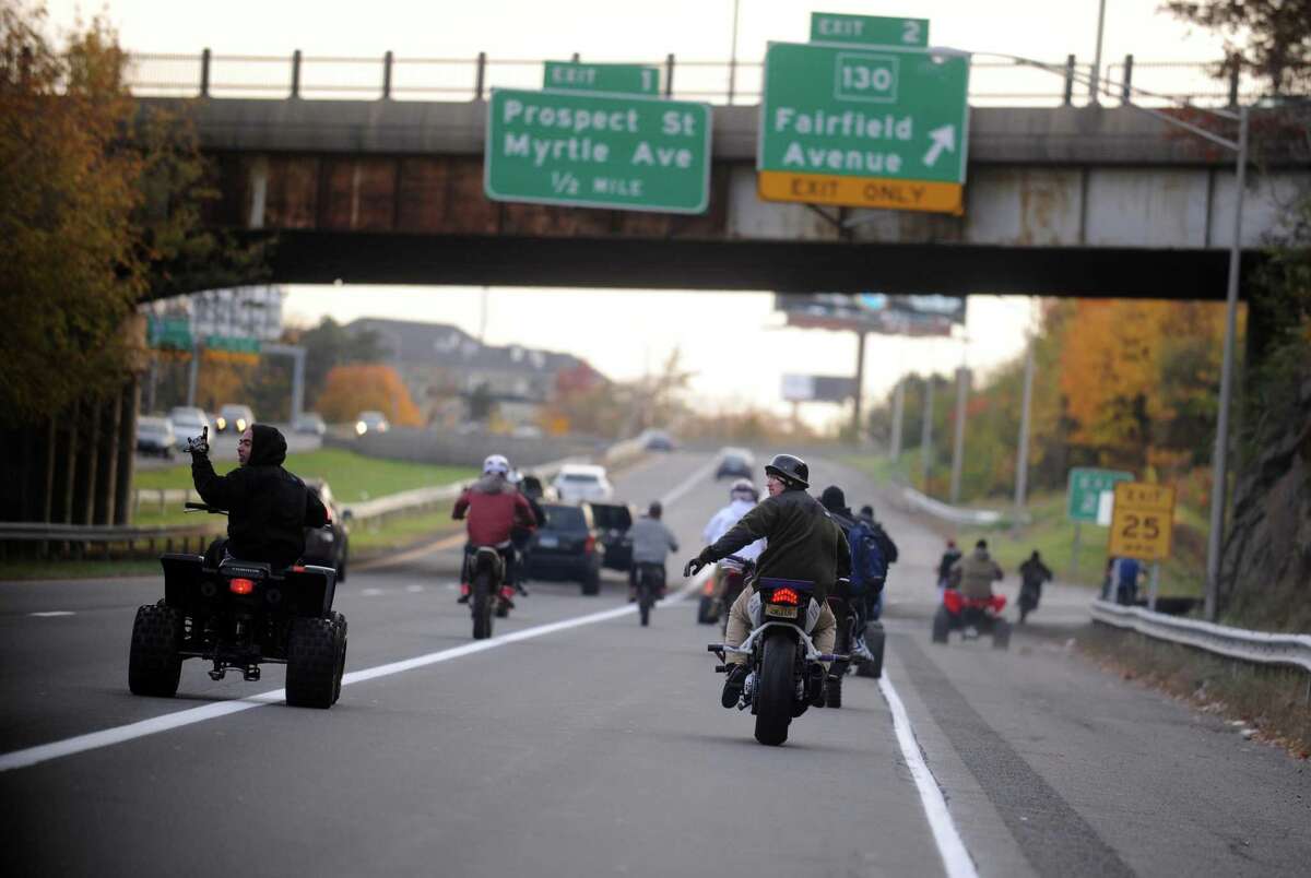 Dozens of riders on ATVs, dirtbikes and street bikes wreaked havoc across Bridgeport Saturday, Nov. 8, 2014 while evading cops and speeding through city streets.