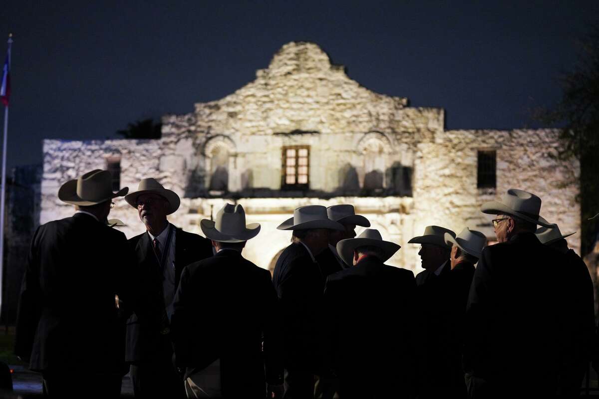 Spectators gather during the annual “Dawn at the Alamo” ceremony to commemorate the beginning of the start of the March 6, 1836, battle of the Alamo.