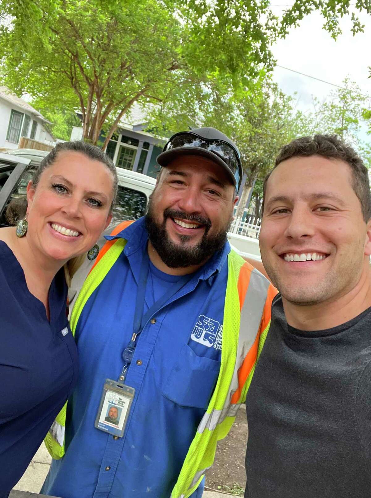 When a water main break was repaired and water restored, midwife Naomi Thomas, from left, SAWS foreman David Sandoval, and Evan Morris, posed for a selfie. A few hours later, Morris' wife, Courtney, safely delivered baby Stella in a water birth.