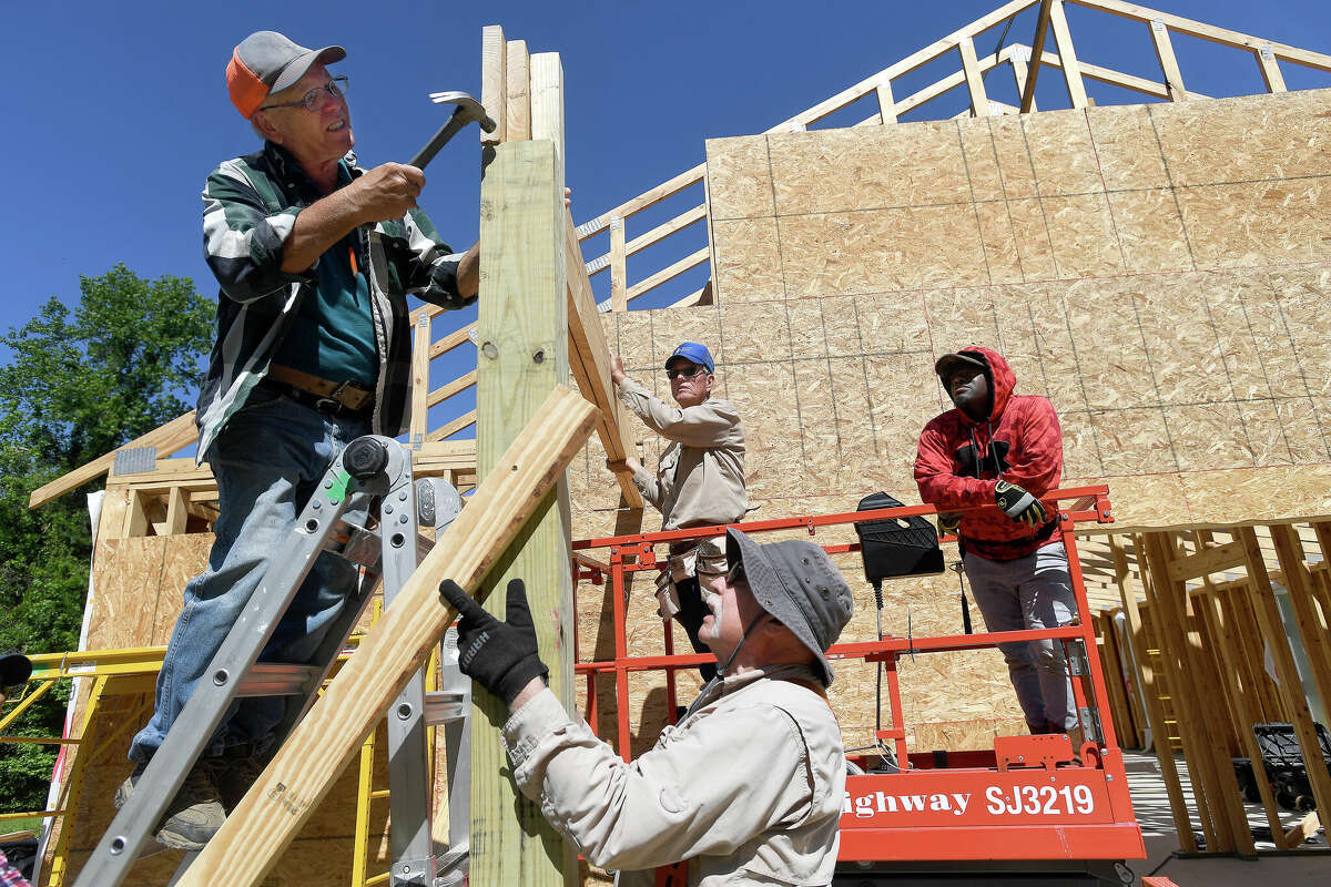 Members of Volunteer Christian Builders, including (from left) Bill Temple, Woody Carter, Harold Oates and DeQuincy Cauley, erect a new church for Union Baptist Church in Silsbee. Photo made Wednesday April 27, 2022. Kim Brent/The Enterprise