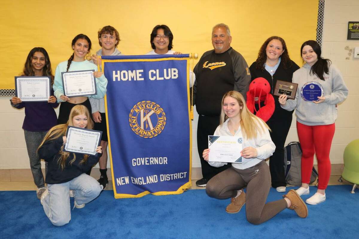 Jonathan Law Key Club members take a moment out of their day to show the awards they brought home from the recent New England District Convention held in Springfield, Mass. Pictured are (front, left to right) Skylar Johnson, Grace Baird (rear) Diya Daruka, Maya Rosado, Ben Rossi, Kyle Chy, Ted Boynton (club faculty advisor), Caroline Doyle, and Hanna Keating.