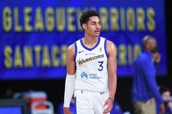 Golden State Warriors guard Jordan Poole throws out the ceremonial first  pitch before a baseball game between the San Francisco Giants and Atlanta  Braves, Sunday, Sept. 19, 2021, in San Francisco. (AP