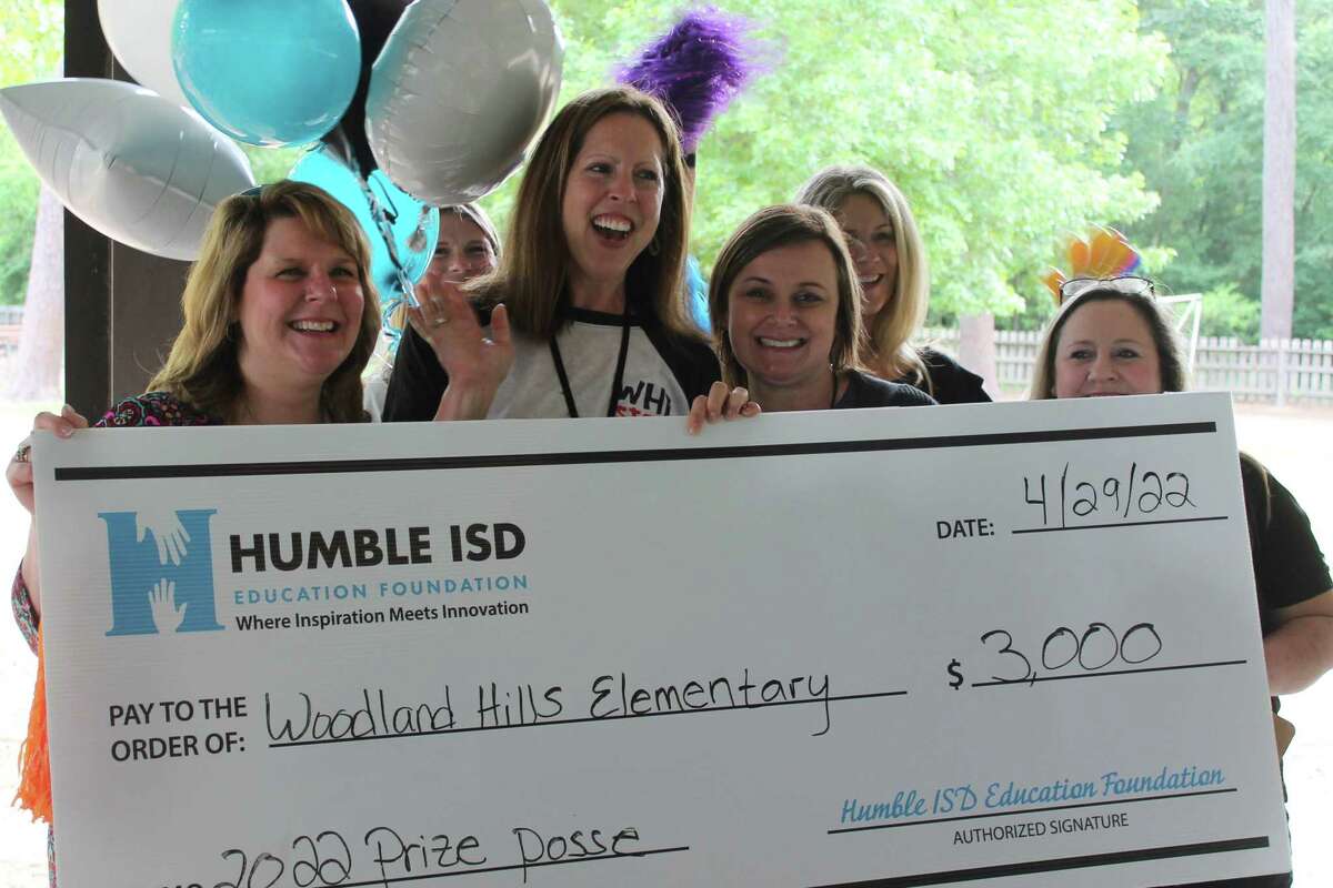 Humble ISD Education Foundation Prize Patrol at Woodland Hills Elementary. From left, Jen Morris, Samantha Morgenroth (teacher at Woodland Hills Elementary), Cindy Barker (principal Woodland Hills Elementary), Christy Tarkington (assistant director, Humble ISD Education Foundation).
