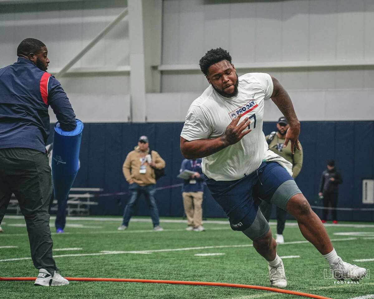 Defensive tackle Travis Jones works out for NFL scouts during UConn football’s pro day at the Shenkman Training Center on March 23 in Storrs.