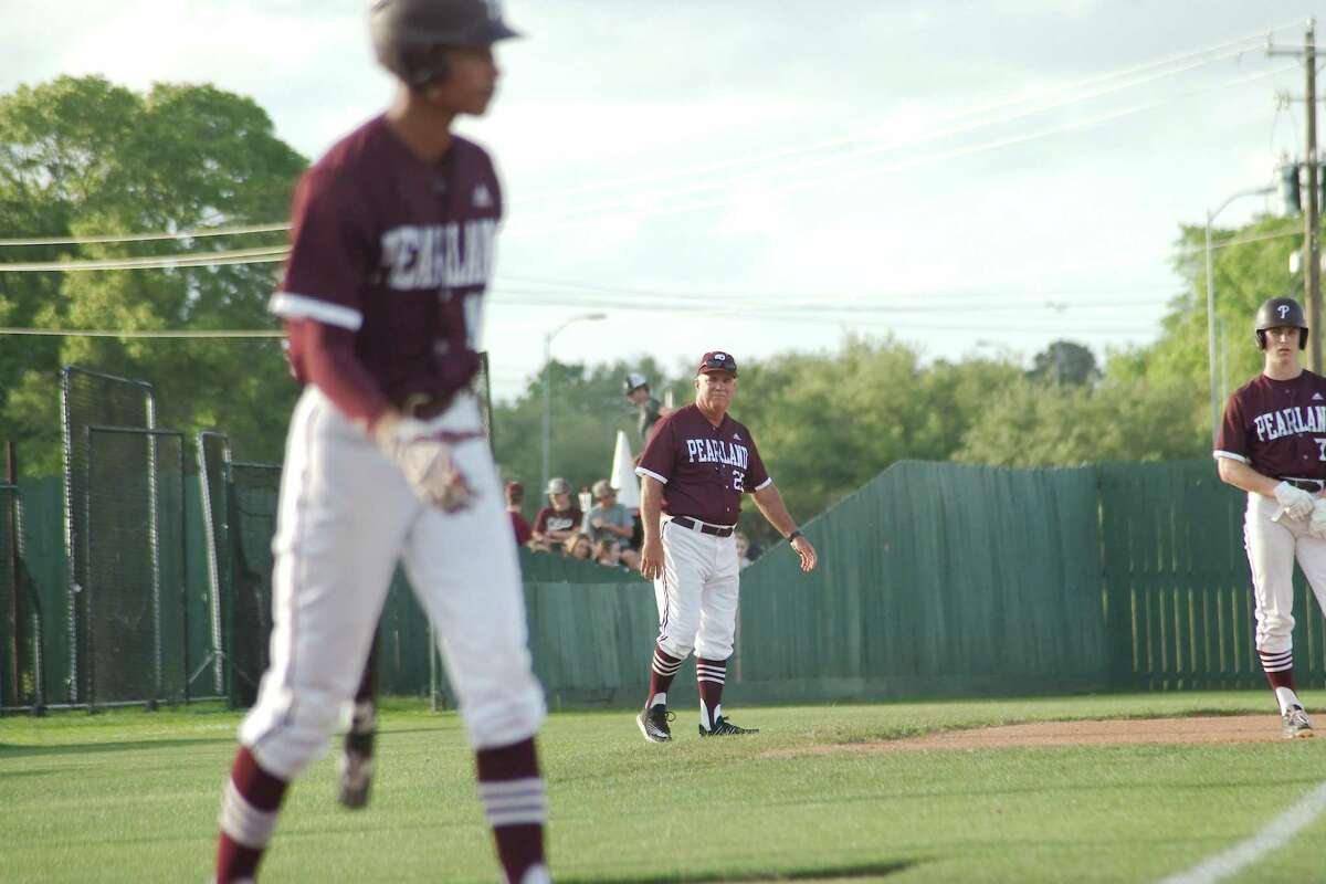 Pearland baseball coach David Rogers monitors the base runners as Pearland's Isaiah Castaneda (15) tries to drive in Pearland's Cole Smajstrla (7) against Dawson Friday, Apr. 29, 2022 at Pearland High School.