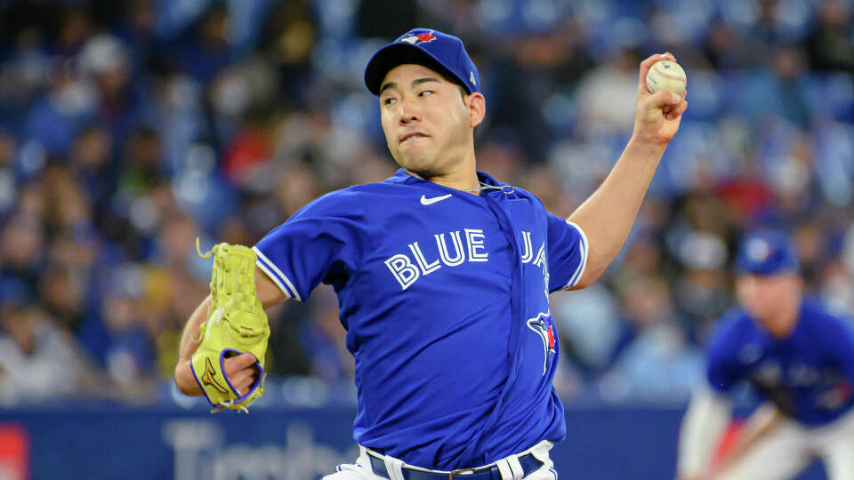 Toronto Blue Jays starting pitcher Yusei Kikuchi throws during the second inning of the team's baseball game against the Houston Astros on Friday, April 29, 2022, in Toronto. (Christopher Katsarov/The Canadian Press via AP)