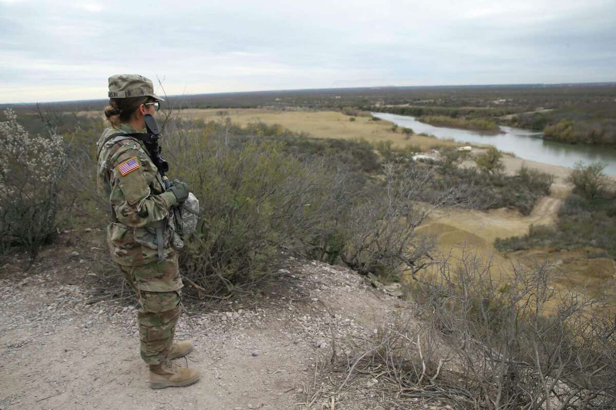 The Texas National Guard keeps an eye on the Rio Grande from a hilltop on a ranch north of Eagle Pass on Jan. 11, 2022. While the families of police and firefighters killed in the line of duty can receive $500,000 under the Texas Government Code, guardsmen cannot. Soldiers and airmen in the guard can buy life insurance policies, but are not required to.
