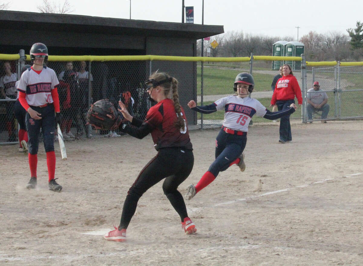 Big Rapids' Zoe Taylor is about to cross the plate with the 16th and final run of the second game in a 16-1 win for the Cardinals on Friday against Fremont.