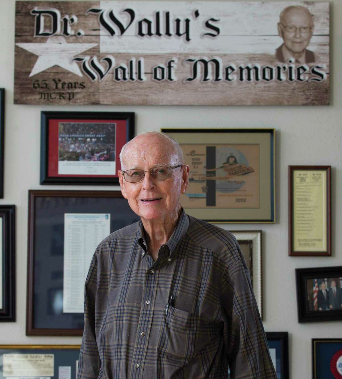 Dr. Walter “Wally” Wilkerson, who served 56 yerars as Montgomery County Republican Party chairman, poses for a portrait in front of his wall of memories at the Montgomery County Republican Headquarters, Wednesday, Dec. 5, 2018, in Conroe. Wilkerson, 91, died Friday night in Conroe.