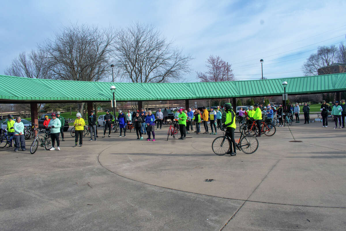Participants join in a prayer before taking off on the Howard's Friend Bike Ride Saturday, April 30, at the Tridge in Midland.