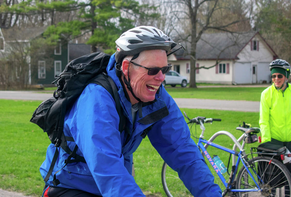 A rider sports a big smile as he rides past the North Bradley checkpoint during the Howard's Friend Bike Ride Saturday, April 30, 2022 in Coleman.