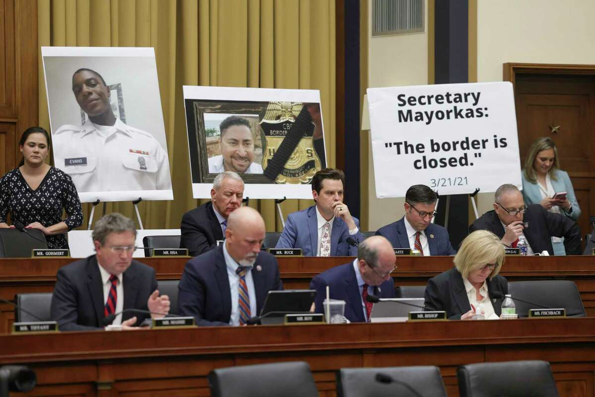House Republicans, including Rep. Chip Roy, sit alongside signs as Homeland Security Secretary Alejandro Mayorkas testifies before the House Judicary Committee on April 28, 2022.