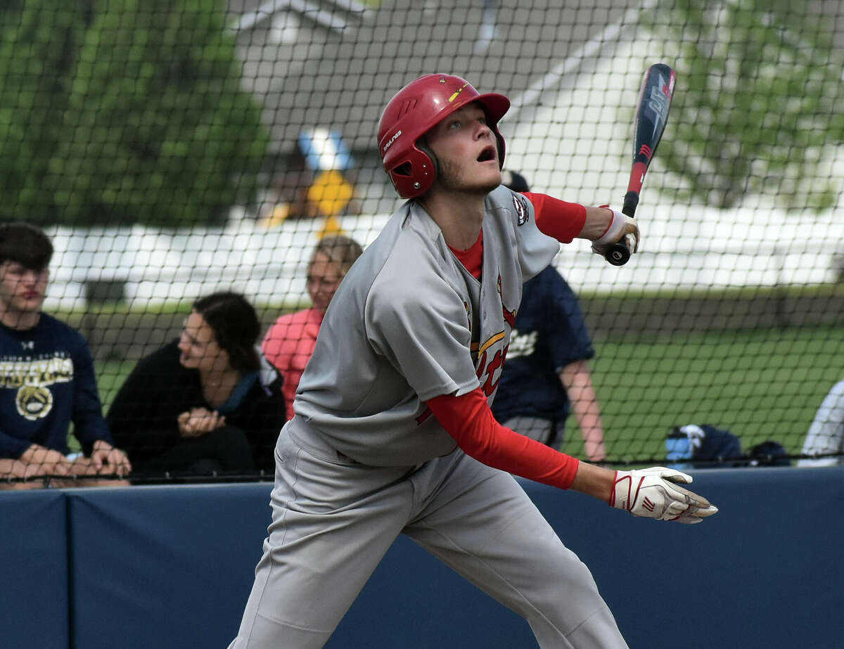Alton's James Stendeback hits a two-run single to right against Father McGivney on Saturday in Glen Carbon.