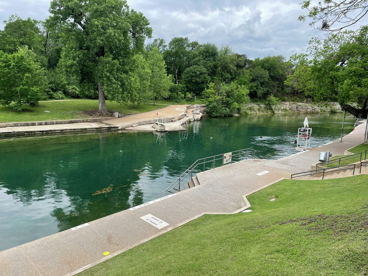 Barton Springs on a closed Wednesday afternoon, except to a few enterprising swimmers.