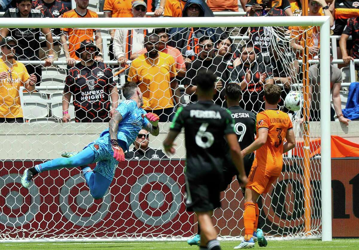 Dynamo goalkeeper Steve Clark, left, watches the ball hit the back of the net in the second half during a match against Austin FC on April 30, 2022 at PNC Stadium.