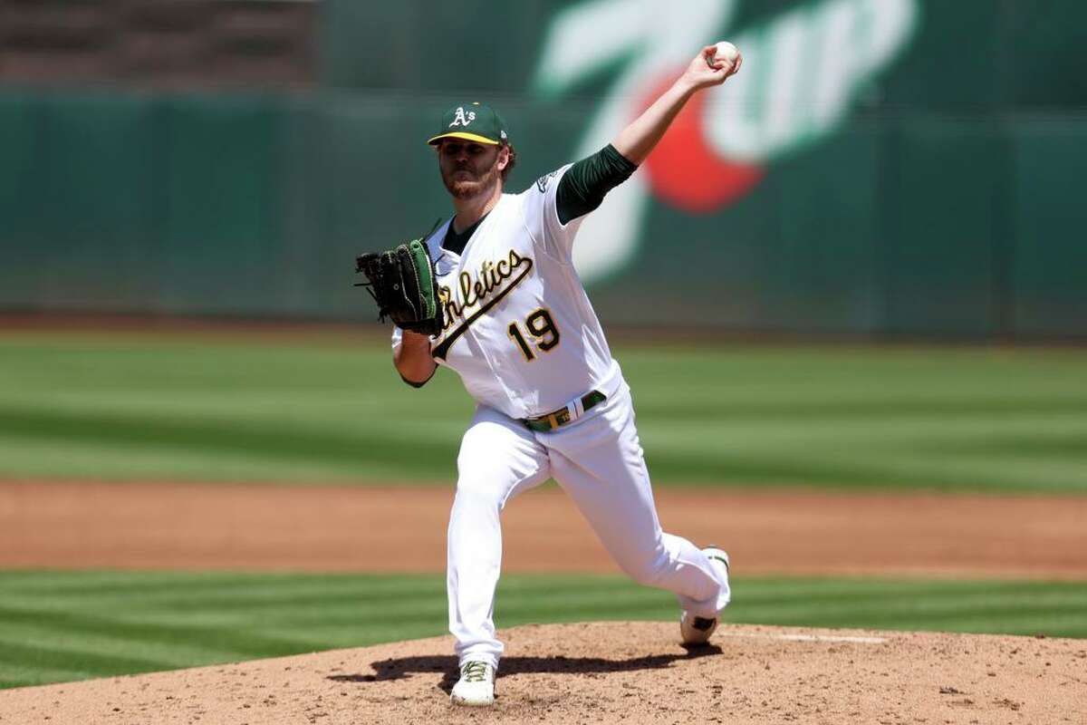 Oakland Athletics starting pitcher Cole Irvin throws against the Cleveland Guardians during the third inning of a baseball game in Oakland, Calif., Saturday, April 30, 2022. (AP Photo/Jed Jacobsohn)