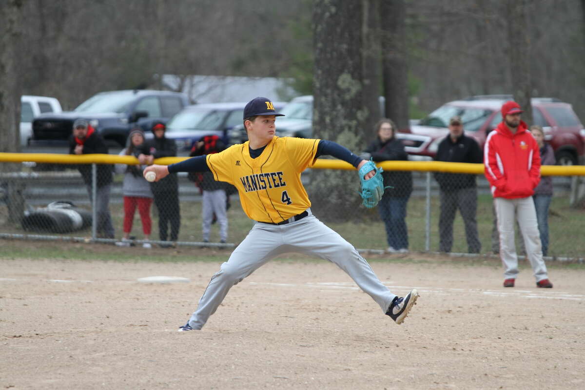 Eli Workman winds up for the pitch. 