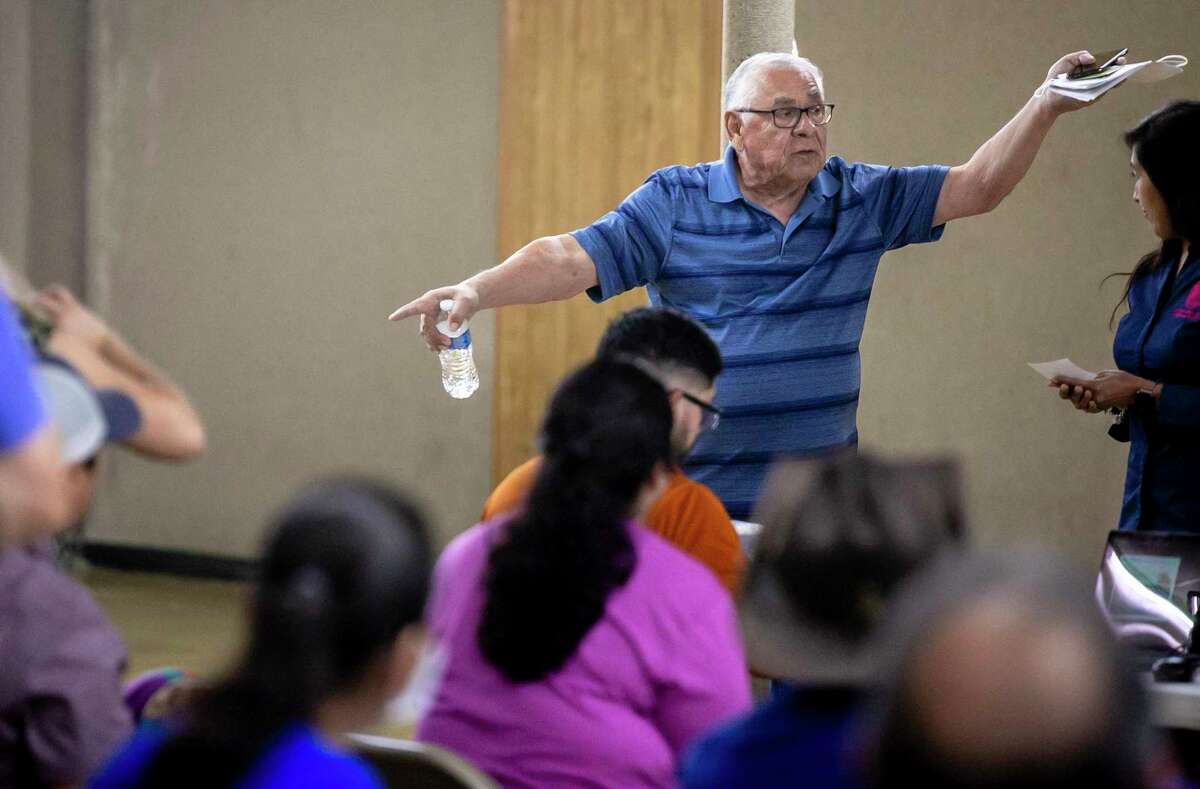 Leonardo Yzaguirre, Jr. raises a question Saturday, April 30, 2022, during a property tax workshop at the St. Vincent de Paul Knights of Columbus Banquet Hall in San Antonio.
