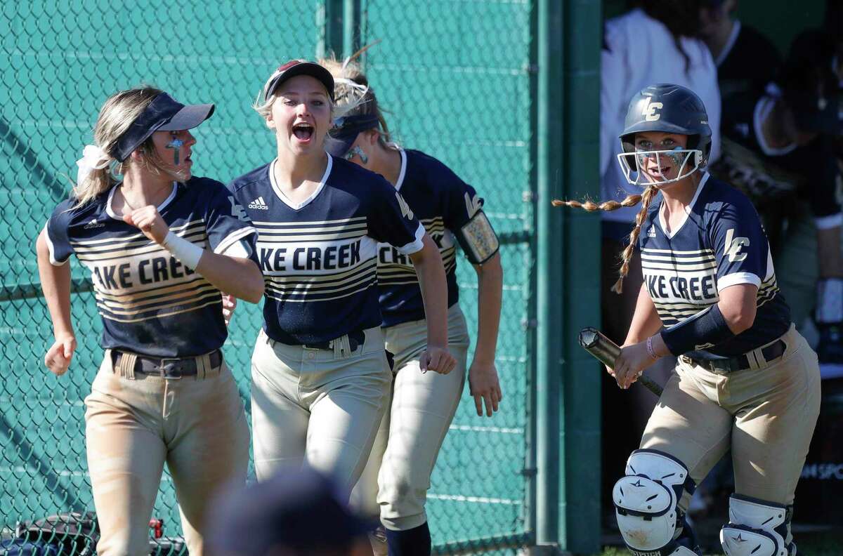 Lake Creek players react after a two-run homer by Ava Brown in the first inning of a District 20-5A high school softball game, Tuesday, March 15, 2022, in Montgomery.