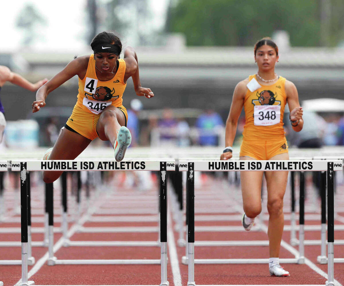 Fort Bend Marshall's Tairah Johnson, left, won a total of four gold medals during the regional championships.
