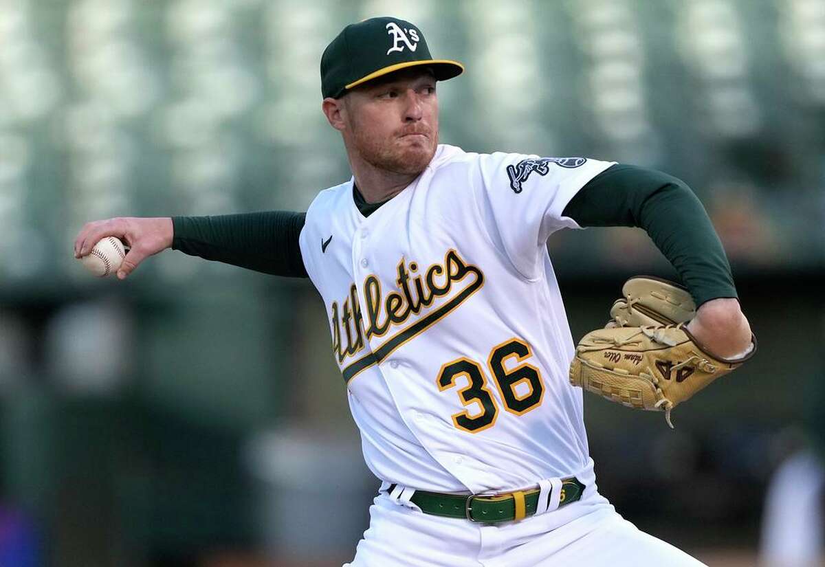 OAKLAND, CALIFORNIA - APRIL 22: Adam Oller #36 of the Oakland Athletics pitches against the Texas Rangers in the top of the first inning at RingCentral Coliseum on April 22, 2022 in Oakland, California. (Photo by Thearon W. Henderson/Getty Images)
